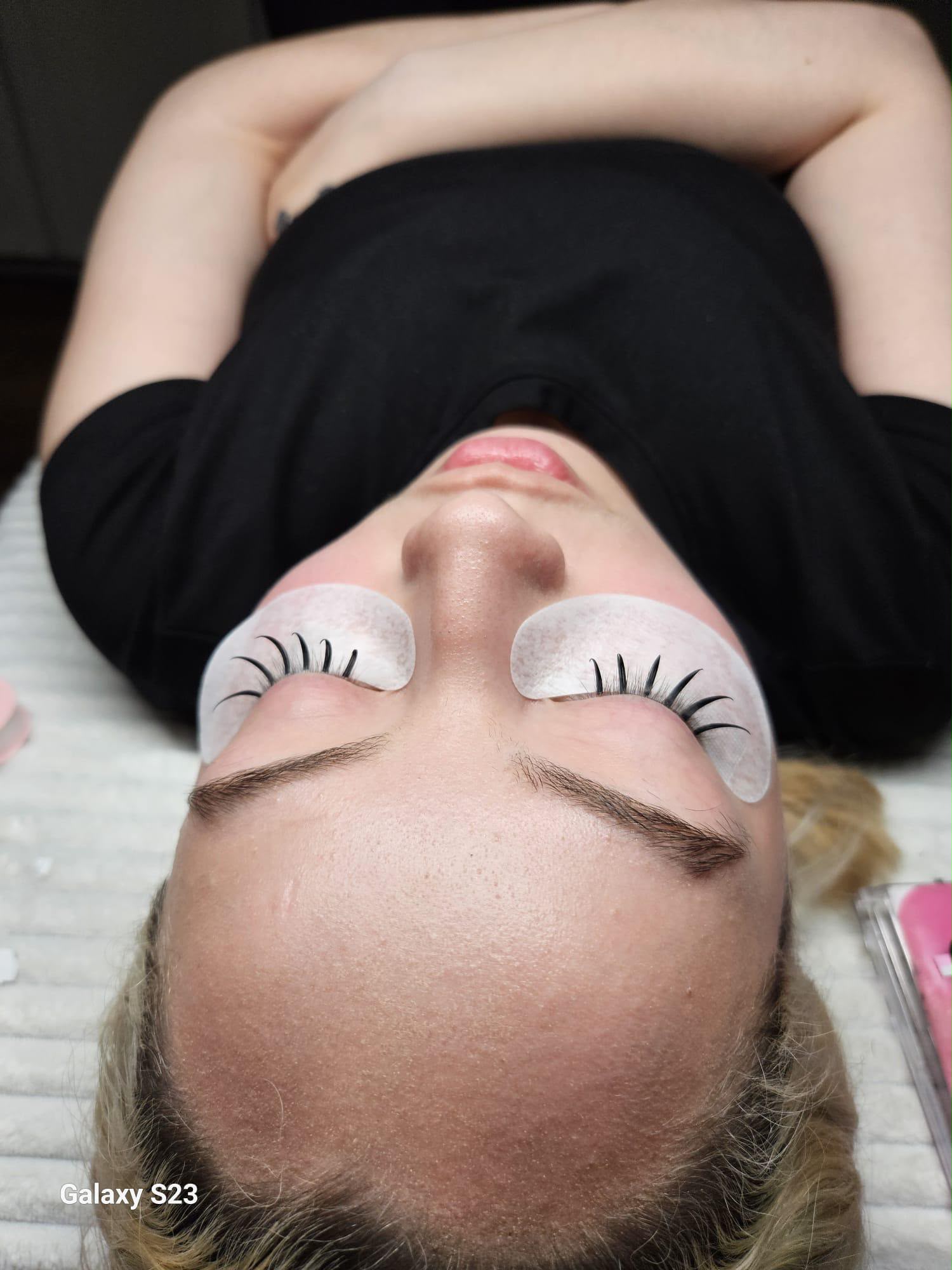 Eyelash extension treatment in progress